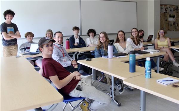 students smiling in classroom 